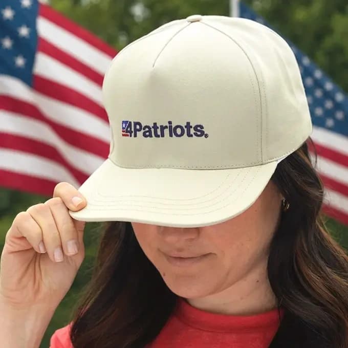 A woman wearing a 4Patriots Hat