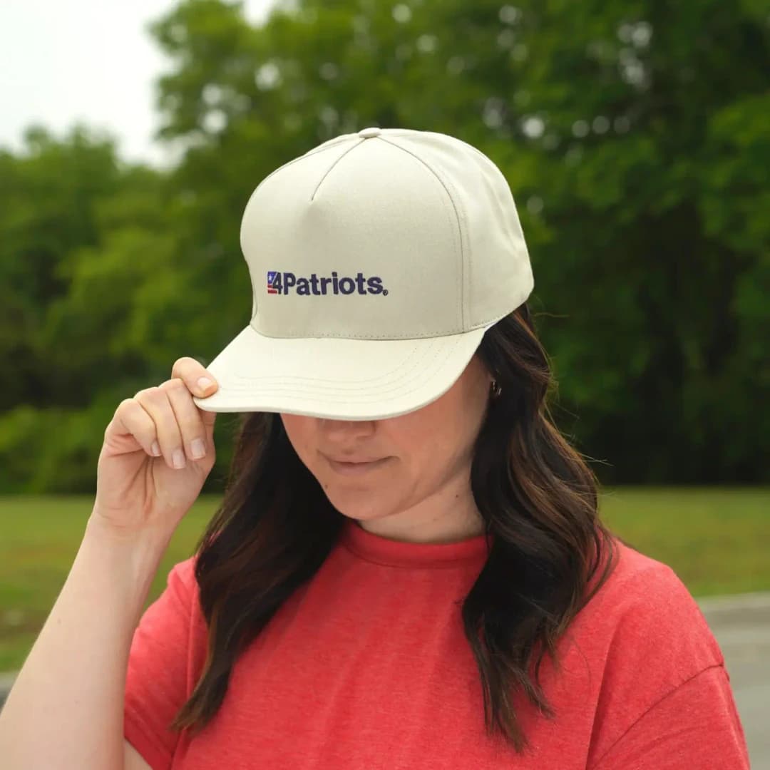 A woman wearing a 250th Anniversary 4Patriots Hat.