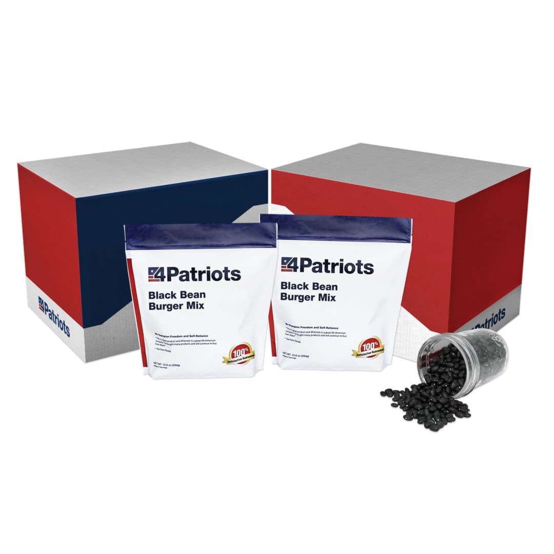 2 4Patriots Black Bean Burger mix pouches sit in front of their holding box. A cup of black bins is tipped over at the side.