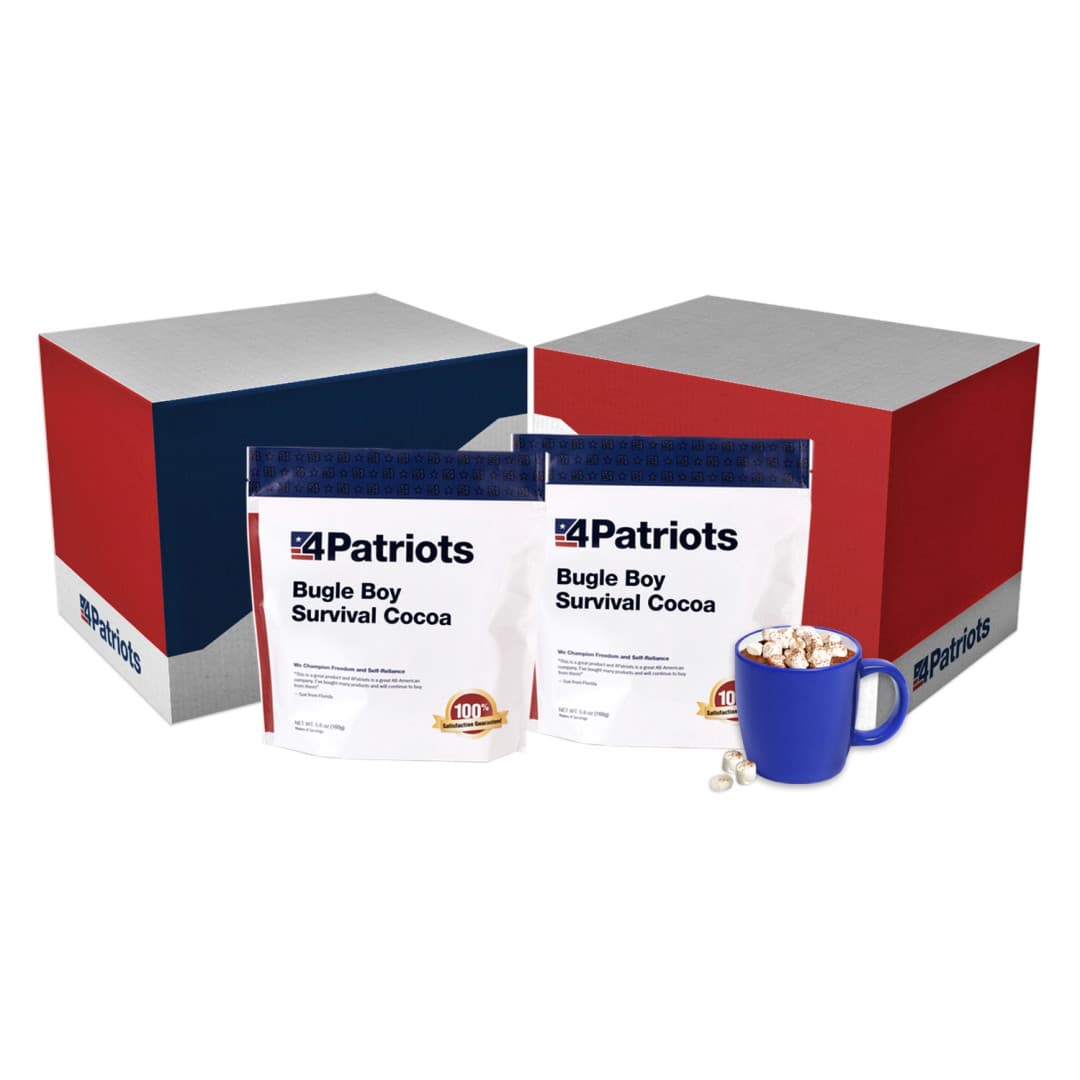 2 pouches of 4Patriots Bugle Boy Survival Cocoa next to their box. Beside them is a mug full of cocoa topped with marshmallows.
