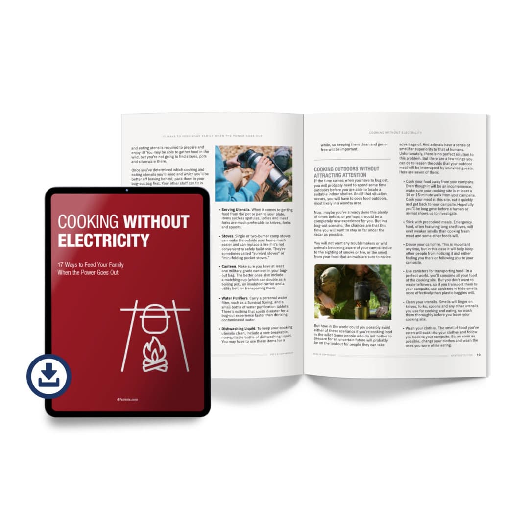 Tablet and open book displaying information on cooking without electricity. The tablet cover features the title "COOKING WITHOUT ELECTRICITY" and the subtitle "17 Ways to Feed Your Family When the Power Goes Out" with a line drawing of a cooking setup over a fire
