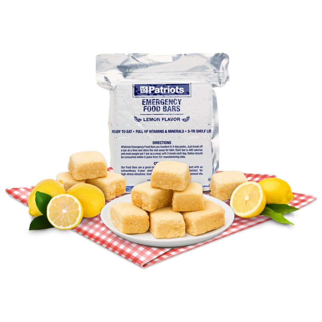 4Patriots Emergency Food Bar single array sitting on top of a red and white checkered background with lemons and food bars spread around the packaging on a white background