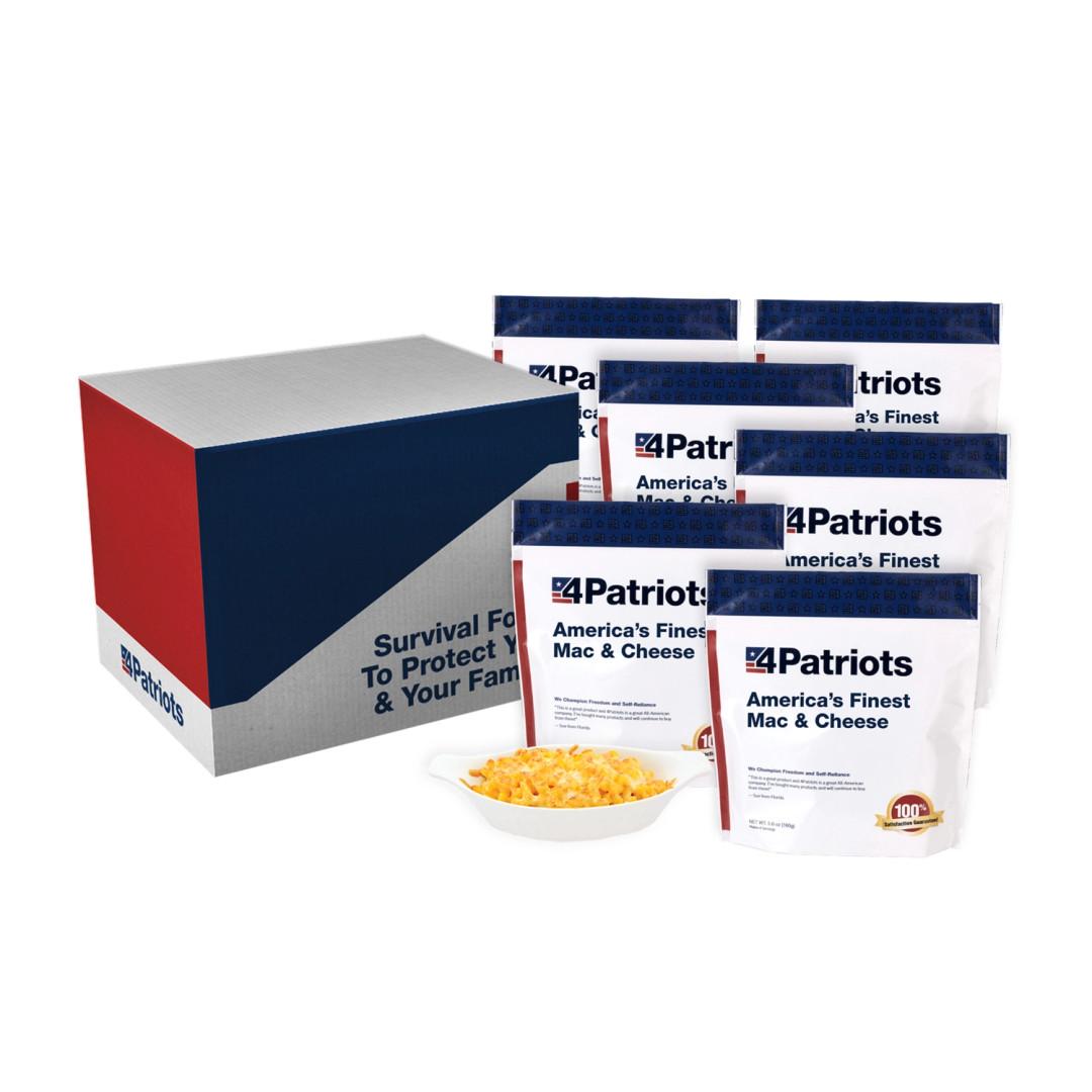 6 pouches of 4Patriots America's Finest Mac and Cheese emergency survival food kit next to their box and a bowl of the contents. More than 1 serving is pictured.