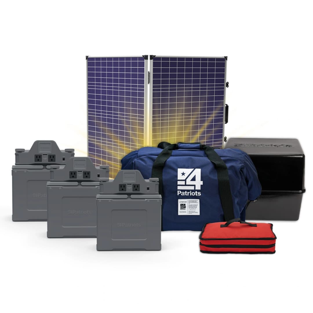A comprehensive 4Patriots emergency power bundle featuring a foldable solar panel, three compact power units, a large blue 4Patriots-branded duffel bag, a red emergency kit, and a black storage box. The solar panel is backlit with a glow, emphasizing renewable energy and off-grid readiness.