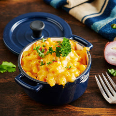 America's Finest Mac & Cheese in a blue dish on a table.