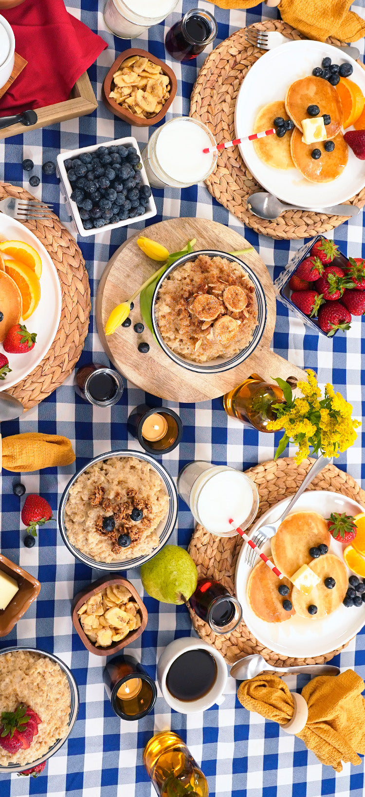 Translation missing: en.4-Week Survival Food Kit: overhead breakfast tablescape of prepared oatmeal, pancakes, milk and fruit made from 4Patriots survival meals