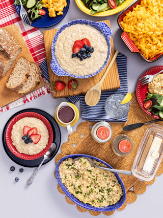 72-Hour Emergency Survival Food Kit meals plated in a flatlay: oatmeal with berries, mac & cheese, creamy rice, salad and bread, survival food prepared