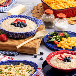 72-Hour Emergency Survival Food Kit meals served on a table: oatmeal with berries, mac & cheese and creamy rice dinner, prepared emergency food