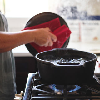 Square crop of a hand lifting a lid off a pot of boiling water on a stove, easy-prep 72-Hour PlatinumXL Emergency Survival Food Kit emergency meals