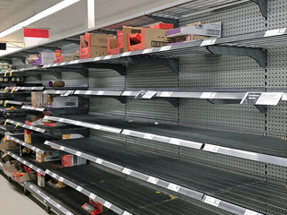 Bare, stripped grocery store shelves during a shortage, a reason to keep a 72-Hour PlatinumXL Emergency Survival Food Kit emergency food supply at home
