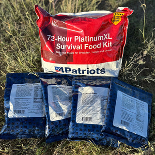 72-Hour PlatinumXL Emergency Survival Food Kit meal packets laid out on grass at sunset, survival food for camping and preparedness