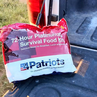72-Hour PlatinumXL Emergency Survival Food Kit pouch sitting in a pickup truck bed outdoors, grab-and-go emergency food kit