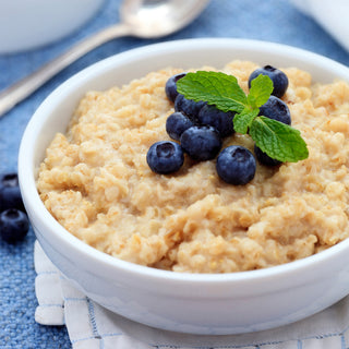 Bowl of Country Griddle Breakfast Kit oatmeal topped with fresh blueberries and mint, a hearty emergency food breakfast
