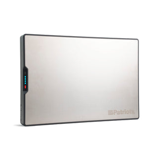 The Blackout Buddy Emergency Power Supply shown on white, a slim stainless plug-in battery backup with an LED charge gauge for power outages