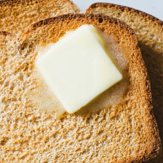 4Patriots Butter Powder #10 Can reconstituted into a melting pat of butter on golden toast, a serving idea for this shelf-stable survival food