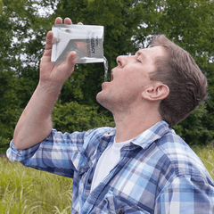 Man drinking emergency drinking water included in the Patriot Power All-in-1 Emergency Car Kit