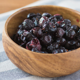 Freeze-Dried Blueberries Case Pack berries rehydrated and served glossy in a wooden bowl, ready-to-eat survival food for emergency food storage