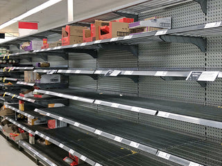 Bare grocery store shelves during a shortage, the empty-pantry risk the Family Favorites Emergency Survival Food Package is built to cover.