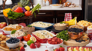 Abundant kitchen spread of prepared 4Patriots survival meals and freeze-dried fruit, from chicken and rice to ground beef, pasta and berries, a family food supply for long-term food storage