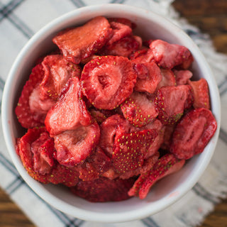 Freeze-Dried Sliced Strawberries #10 Can contents shown top-down in a white ramekin of red strawberry slices, emergency food survival supply.