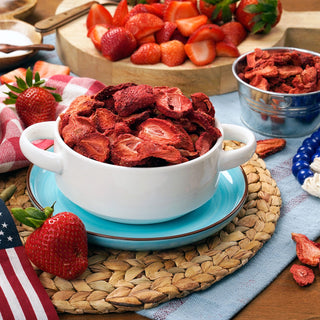 Freeze-Dried Sliced Strawberries #10 Can served in a white handled bowl with fresh berries and a flag, patriotic survival food display.