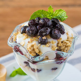 Yogurt and granola parfait topped with freeze-dried blueberries from the 4Patriots Fruit, Veggie & Snack Survival Food Kit and fresh mint