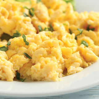 Gluten-Free Variety Recipes #10 Can prepared as fluffy scrambled eggs from whole egg powder on a white plate, survival food breakfast.