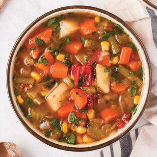 Gluten-Free Variety Recipes #10 Can prepared as a bowl of hearty vegetable soup with carrots and corn, survival food meal.