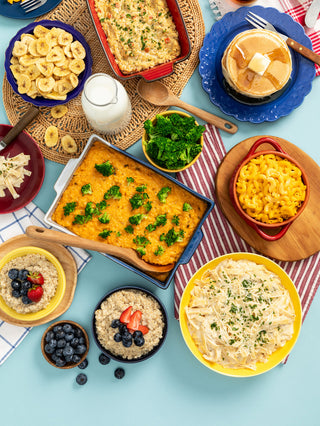 Gold Reserve Emergency Survival Package: 4-Week kit flatlay of prepared broccoli cheddar casserole, mac and cheese, pasta and oatmeal, long-term food storage