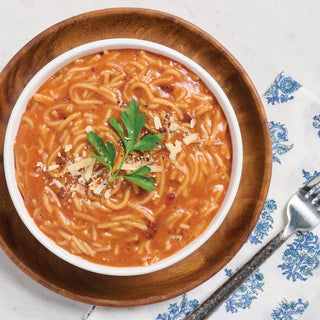 Nonna's Secret Recipe Spaghetti Pouch prepared as spaghetti in creamy tomato sauce with parmesan and parsley in a wooden bowl, survival meals