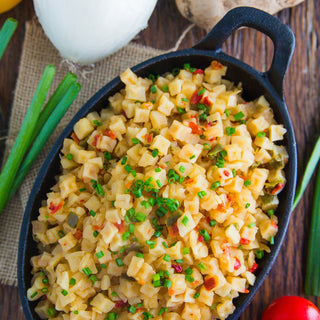 Potatoes O'Brien Pouch prepared into a cast-iron skillet of diced potatoes with peppers and chives, a hearty survival food side dish