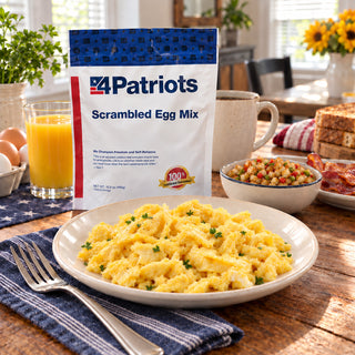 Scrambled Egg Mix Pouch in a bright kitchen with a plate of soft scrambled eggs, a coffee mug, sunflowers and diced hash, emergency food supply