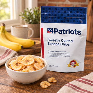 Sweetly-Coated Banana Chips Pouch on a kitchen counter behind a bowl of crunchy banana chips, fresh bananas and a coffee mug, snackable emergency food