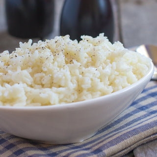 Long Grain White Rice Pouch prepared as a white bowl of steamed rice seasoned with cracked pepper, survival food side dish