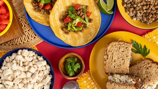 Gold Medallion All-Meat Emergency Survival Kit in a colorful flatlay of ground beef tacos, cooked ground beef, diced chicken and a chicken salad sandwich, freeze-dried long-term food storage