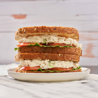 Stacked chicken salad sandwich made with freeze-dried chicken from the Meat & Protein Deluxe Emergency Survival Food Kit, lettuce and tomato