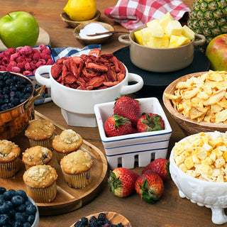 Endless Orchard All-Fruit Survival Food Kit: bowls of freeze-dried strawberries, raspberries, blueberries, pineapple, apple and banana chips with fresh fruit and muffins, long-term food storage