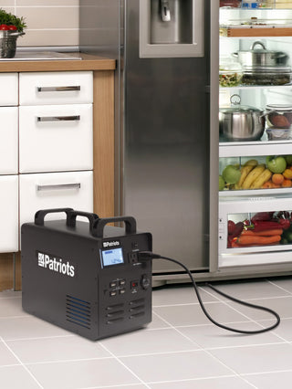 Patriot Power Solar Generator 1800 on a kitchen floor powering a stocked stainless refrigerator, portable solar generator delivering emergency backup power during an outage