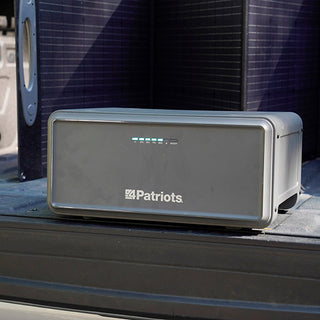 Expansion Battery Pack for Patriot Power Generator 2200X, a single pack in a truck bed with a 200W folding solar panel behind for off-grid portable solar power