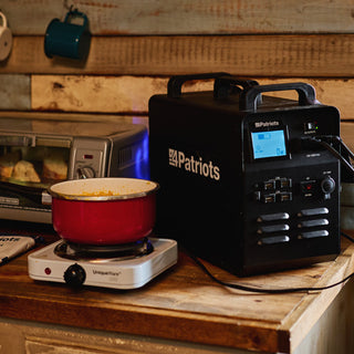 Patriot Power Generator 1800 + Sidekick Kit: the 1800 generator in a rustic cabin powering an electric hot plate cooking a pot of food, off-grid portable solar backup power