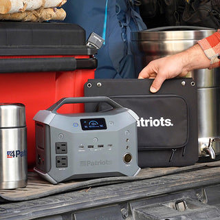 Patriot Power Generator 2000X + Sidekick Kit Sidekick unit packed with a solar panel and other 4Patriots gear in a truck bed for off-grid emergency backup power on the go