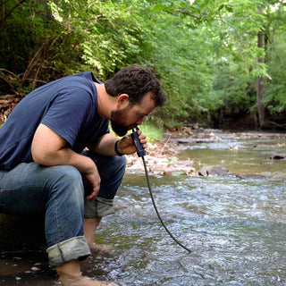 3-Day Emergency Backup Package personal water filter used to drink directly from a creek, a survival water purifier for the outdoors