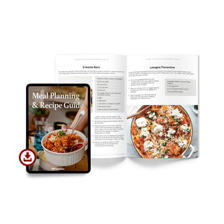Meal Planning and Recipe Guide for the 4Patriots Survival Food Kit on a tablet beside printed pages of S'mores Bars and Lasagna Florentine recipes