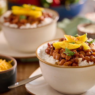 Aztec Chili with Mango from the Comfort Classics Survival Food Kit served over rice with fresh mango slices and cilantro