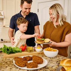 Parents and child preparing a burger with 4Patriots Black Bean Burger Mix