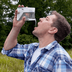 Man drinking 4Patriots Emergency Drinking Water outside