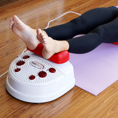 Person laying down on a mat using Vital Swing Therapeutic Wellness Machine
