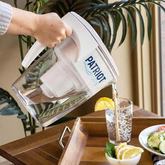 Pouring water into a class using the patriot pure pitcher.