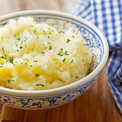Mashed potatoes served in bowl.