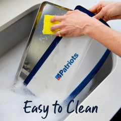 Someone cleaning a Home Freeze-drying system tray in the sink. Easy to clean.